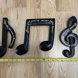 Three decorative music notes