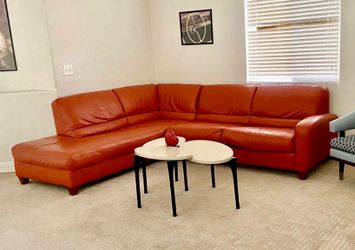 Orange leather L-shaped sectional sofa