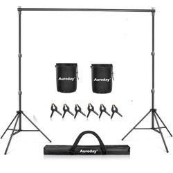 NEW! Aureday Backdrop Stand, 10x7 Ft Adjustable Photo Backdrop Stand Kit with 4 Crossbars, 6 Background Clamps, 2 Sandbags, and Carrying Bag for Parti