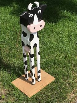 Outdoor yard art, handmade wooden cow