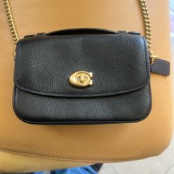 Brand New Woman’s Leather Coach Clutch 