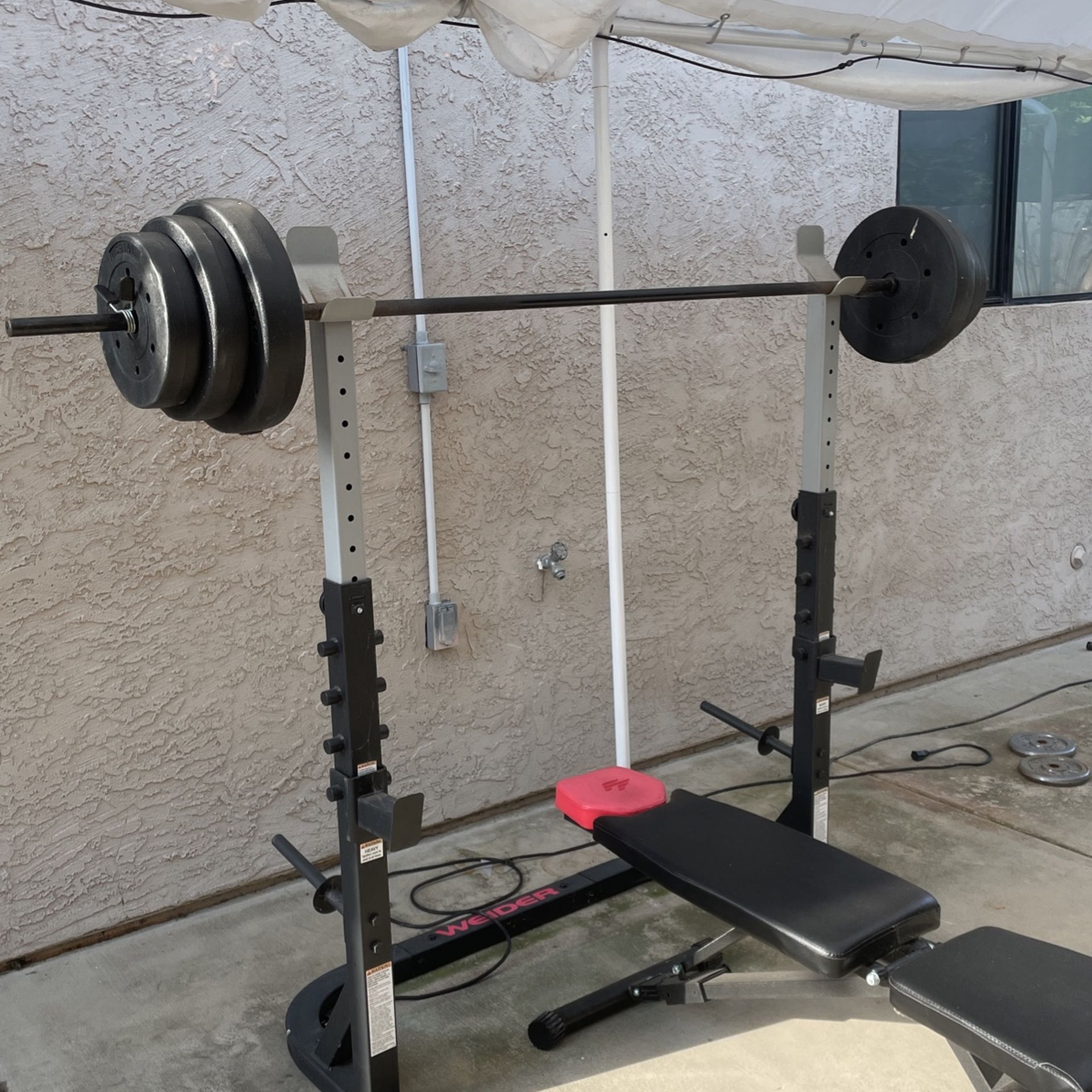 Bench And Squat Rack with bench, bar and weights for Sale in San Diego