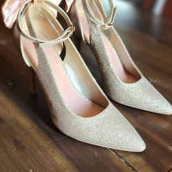 Gold high heel shoes with removable satin bow