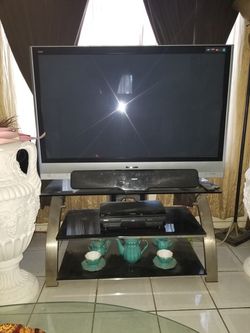 T.V. STAND WITH 50" PANASONIC T.V. FLAT SCREEN and WALL MOUNT BRACKET