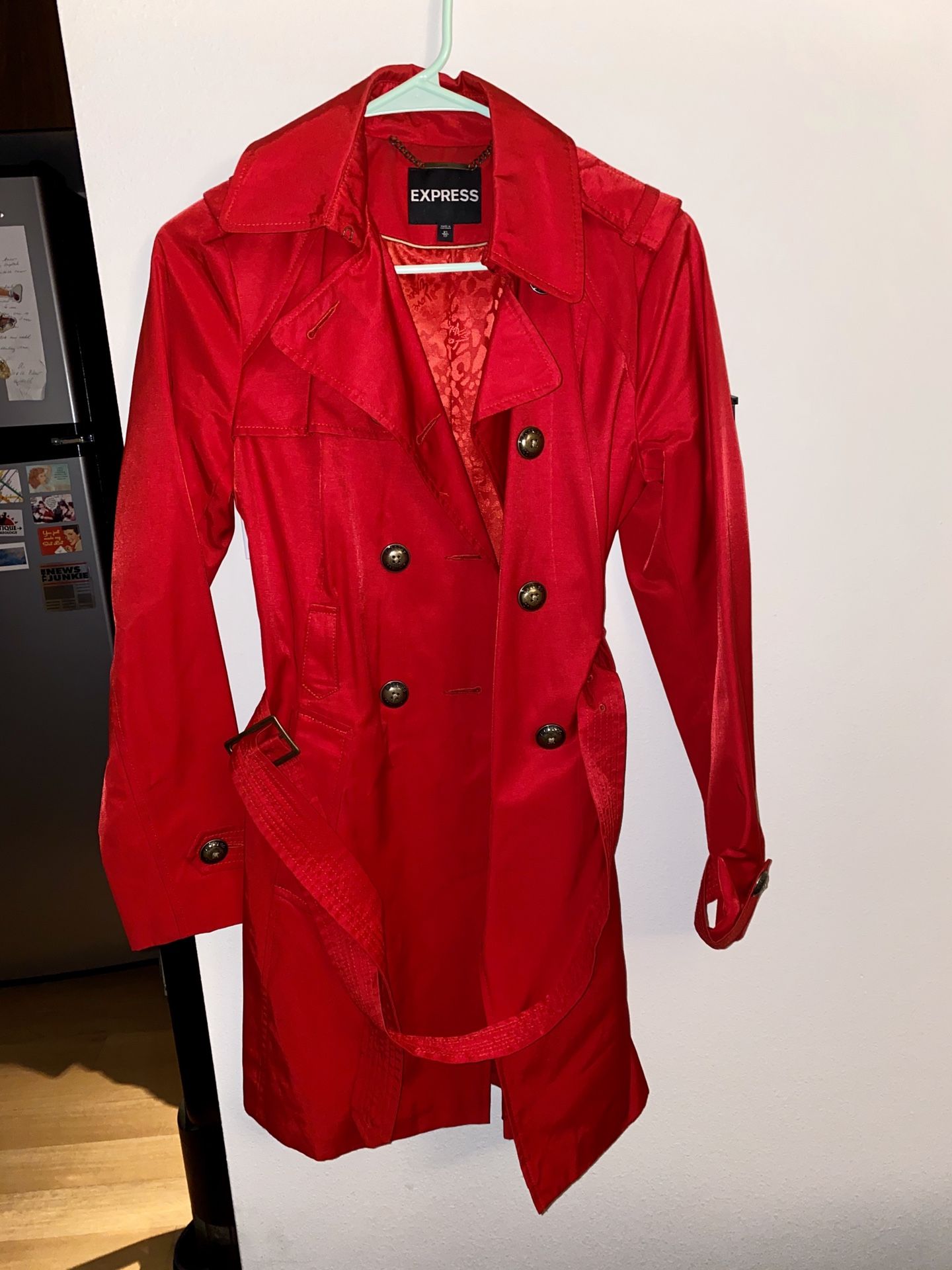 Raincoat Express. Women’s XS the shine is from the flash