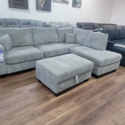 New 2pc Sectional And Storage Ottoman In Fog 