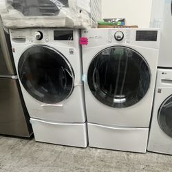 LG FRONT LOAD WASHER AND GAS DRYER WITH PEDESTALS