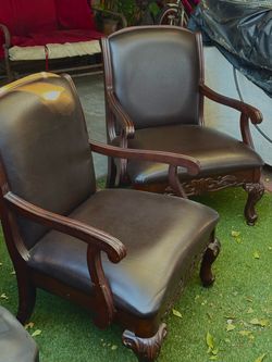 Dark Leather Carved Wood Armchairs