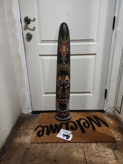 hand-painted Indonesian face mask sculpture. 