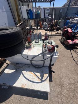 shaped truck bed fuel transfer tank with a mounted 12V pump