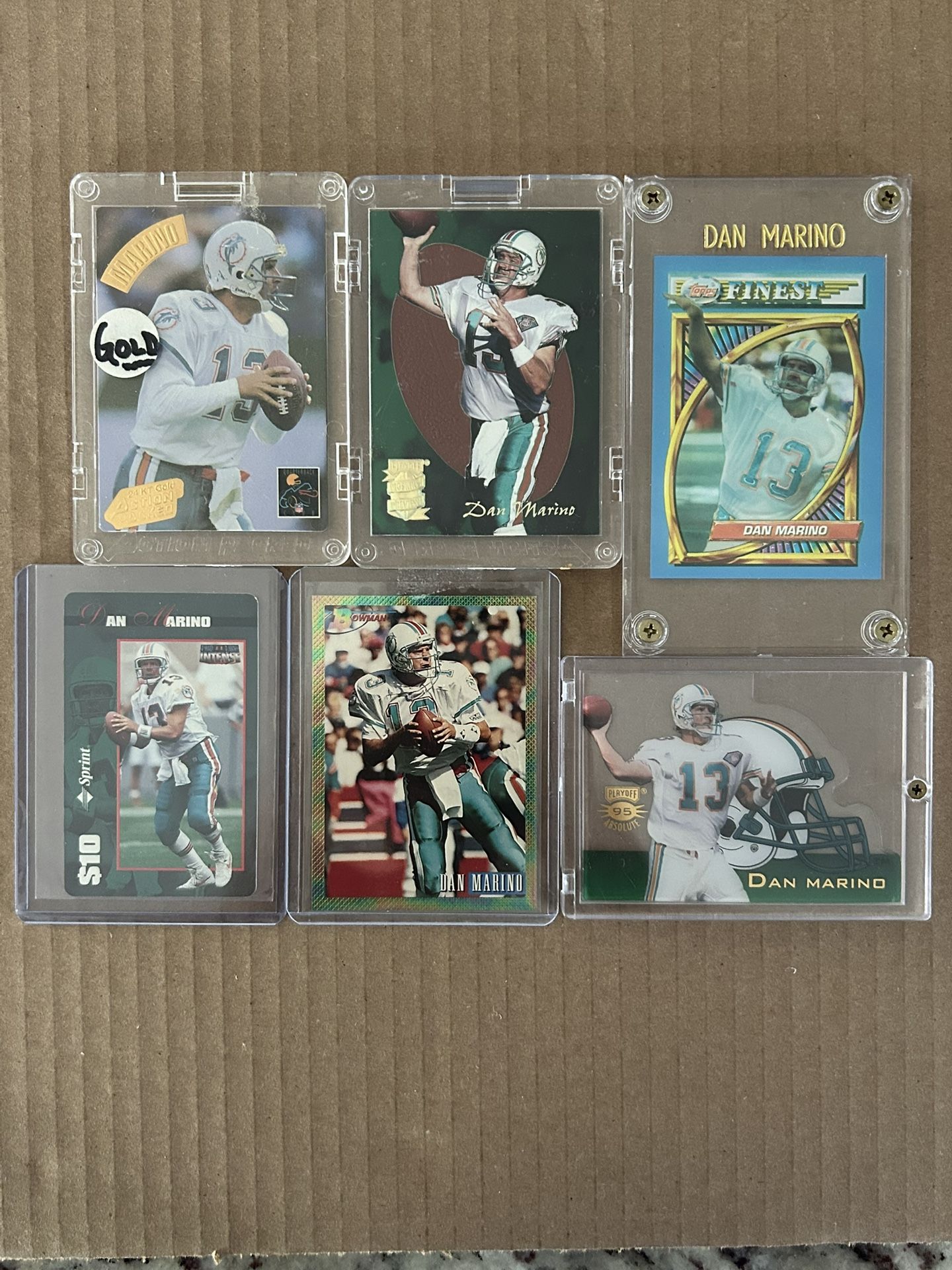 “DAN MARINO”  (6)Card Lot:  Bowman’s, Playoff- Absolute, Pigskin Preview, Action Packed”GOLD”, Topps Finest, $10 Phone Card. NM/M!!!😎
