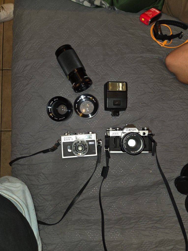 Canon AE-1. Is The One On The https://offerup.com/redirect/?o=UmlnaHQucmljb2g= 500 G On The Left Plus Some Lenses
