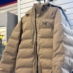 Arc'teryx Fissile Down Jacket in a tan/khaki 