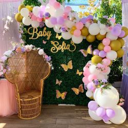 Baby shower set up, baby blocks, peacock chair, balloon garlands/archs