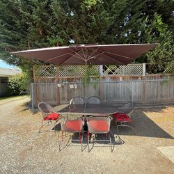 Woodard Wrought Iron Table And six spring chairs?