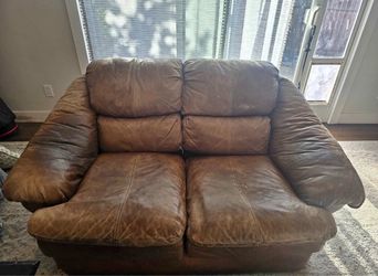 Beautiful brown leather loveseat.