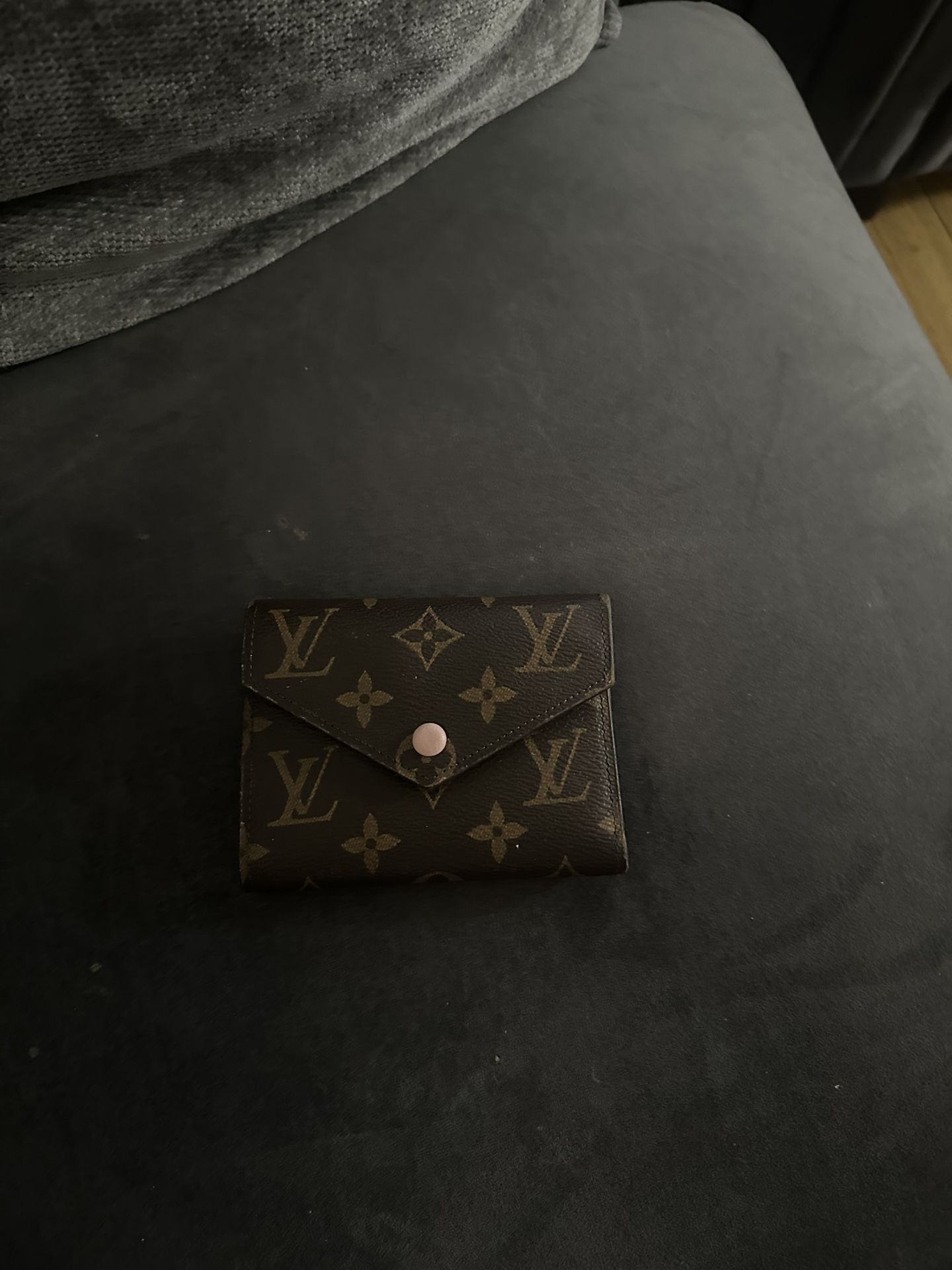 L.  V wallet with pink interior 