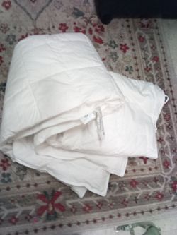 King size down comforter. Brand new