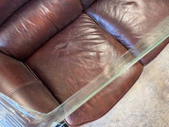 Genuine leather couches, and Ottomans