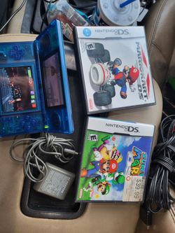 Clear blue Nintendo ds lite Great Condition Working Perfectly with super Mario , Mario Kart, charger , stylus