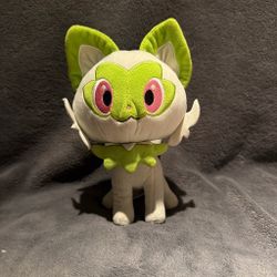 Sylveon plush with green face, pink eyes, and green ears and collar Pokémon kawaii