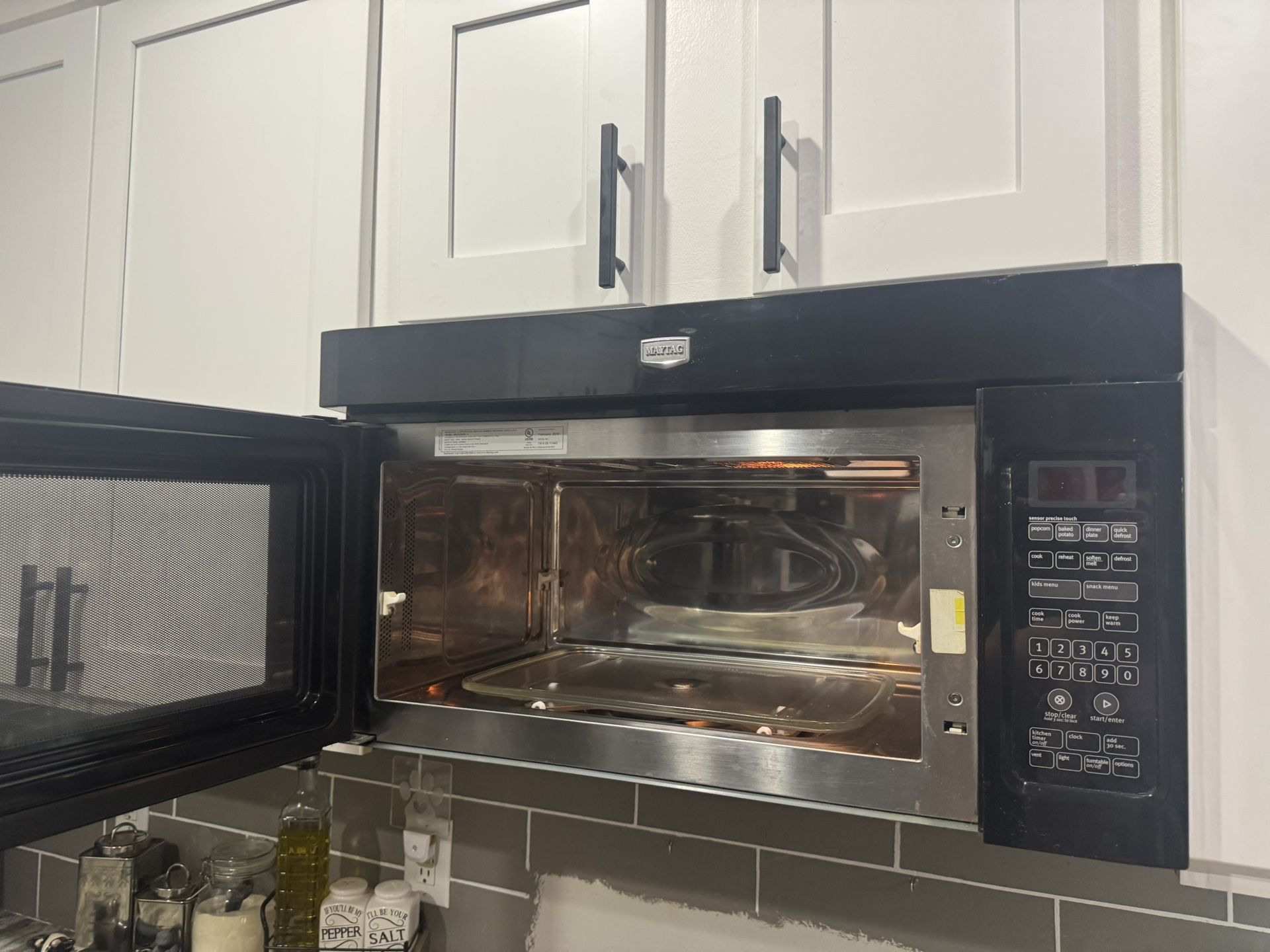Black Maytag Microwave Over Stove