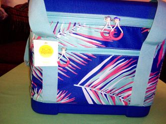 Travel cooler with drink holders on top, velcro opening on top, and compact.