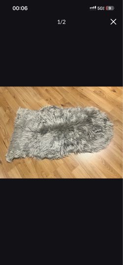 Gray fluffy fur rug