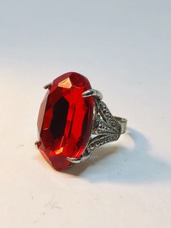 Fashion ring with faux red stone in silver tone