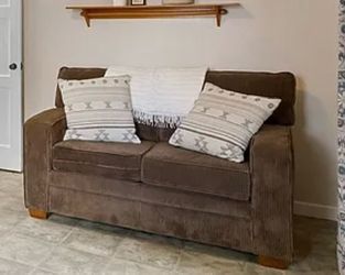 Loveseat with pull down bed