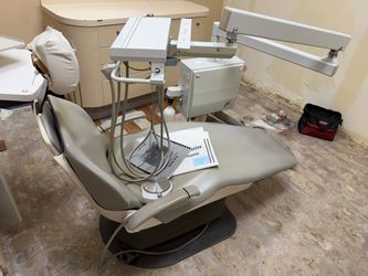 Dental chair with dental unit.