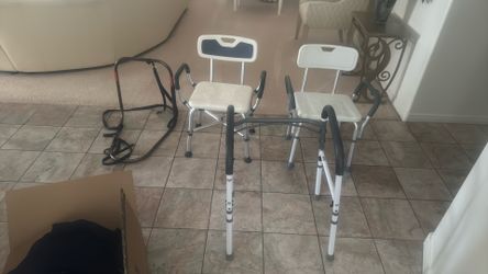 Two shower chairs, a toilet assistant, bed rail