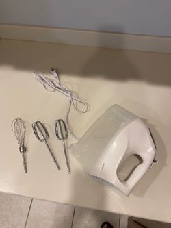 Hamilton Beach electric hand mixer with attached storage
