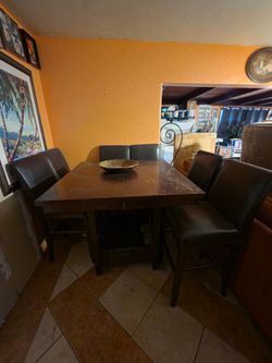 6 Barstool Height Swivel Chairs and expandable table