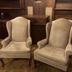 two gold statement chairs 