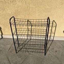 4 Tier black metal wire shelving unit a shoe rack, $10