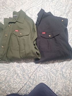 Size 2x mens wrangler long sleeve shirts. Color hunter green and dark blue. New never worn both Together 25 dollars total new never worn