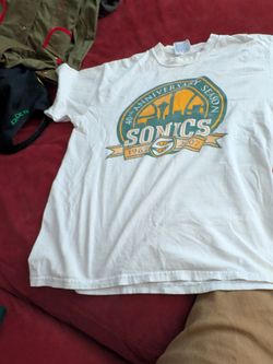 Vintage sonics memorabilia autographed shirt from 2007 and roster book signed from multiple sonics players and sonics sweatband $99.for all
