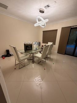 Adjustable Glass Top Dining Table with 6 White Chairs