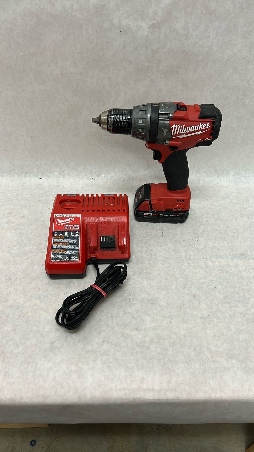Milwaukee fuel half-inch hammer drill driver with battery and charger