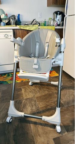 Ezebaby high chair with removable tray and wheels.