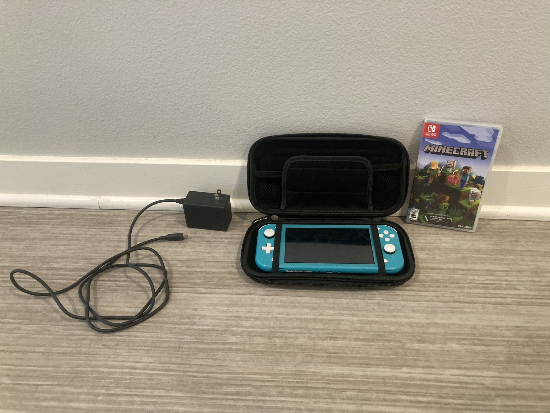 Nintendo switch lite with included case and Minecraft