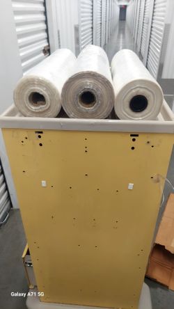 Brand New Rolls of Garment Bags.  One large roll and one regular size roll of Garment Bags.  Also included is a roll of plastic wrap.  21" wide for al