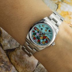 ROLEX OYSTER PERPETUAL 31MM TURQUOISE CELEBRATION DIAL