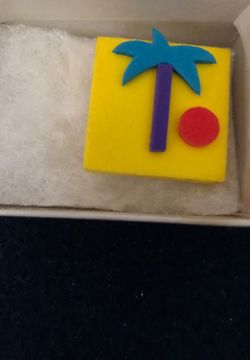 Rubbery pin With palm tree and sun