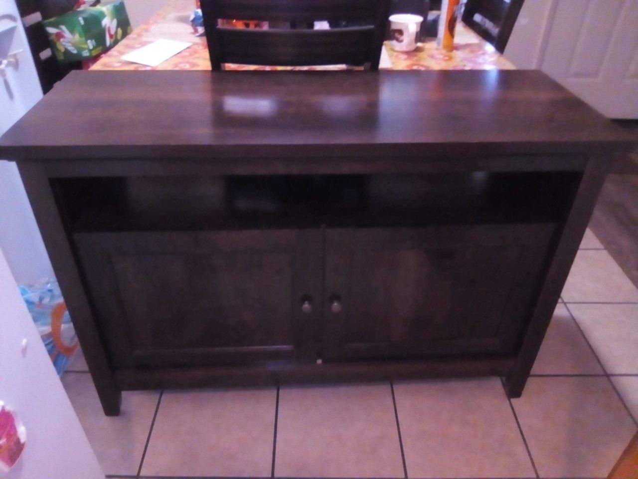 Tv stand holds a 60"tv in good condition solid wood L 47 1/2. 18 wide 31 1/2 high
