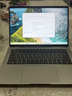 Powerful Dell Latitude 7440 laptop has a 13th Gen Intel Core i7-1365U processor. This gray device is equipped with 16GB of RAM and runs on Windows 11 