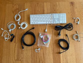 Lot of tech cables power cords keyboard earbuds