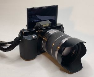Sony NEX-F3 mirrorless camera with 18-55mm lens and strap