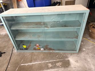 Must go today. Free teal garage or shop cabinet